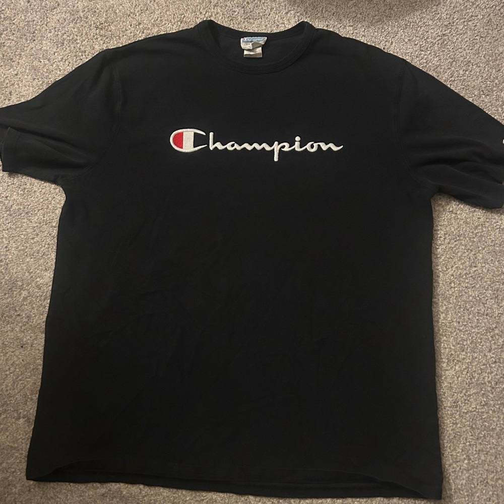 Black champion shirt with red lettering